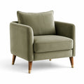 Sillón de terciopelo verde con patas de madera