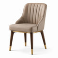 Silla de cuero sintético beige con patas de madera y detalles dorados